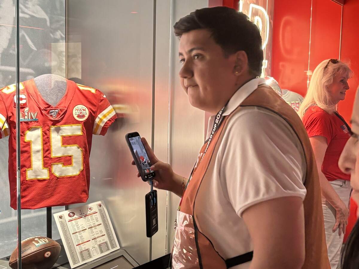 Diego Sancho of Mexico City checks out a Patrick Mahomes Kansas City Chiefs jersey inside the Chiefs Hall of Honor during the Argentina-Algeria FIFA World Cup group-stage match at Kansas City (Arrowhead) Stadium in Kansas City on Tuesday, June 16, 2026.