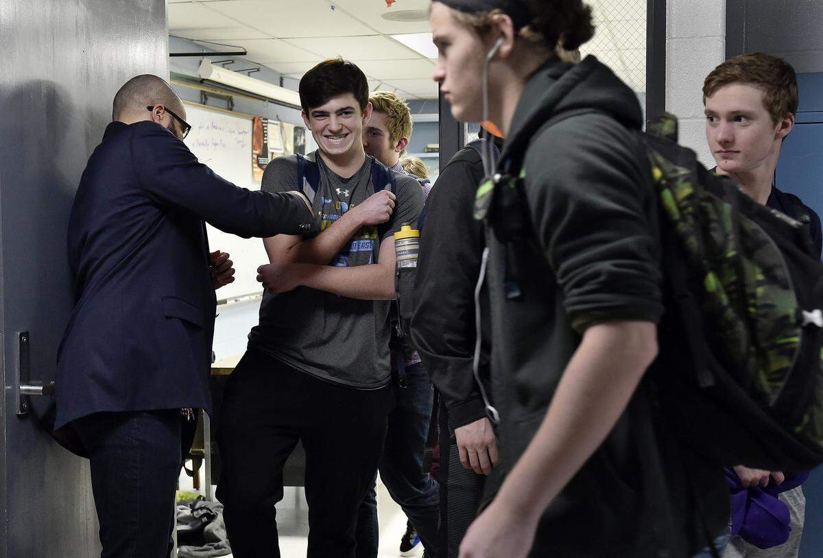 David Muhammad (left), at Shawnee Mission East in 2017, where he taught social studies.