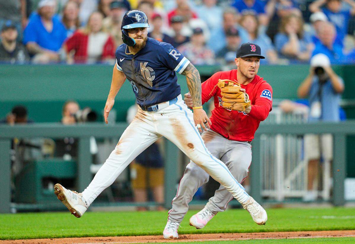 Boston Red Sox third baseman Alex Bregman, right, tags out Royals center fielder Kyle Isbel during the fifth inning of a Friday, May 9, 2025 Major League Baseball game at Kauffman Stadium in Kansas City.