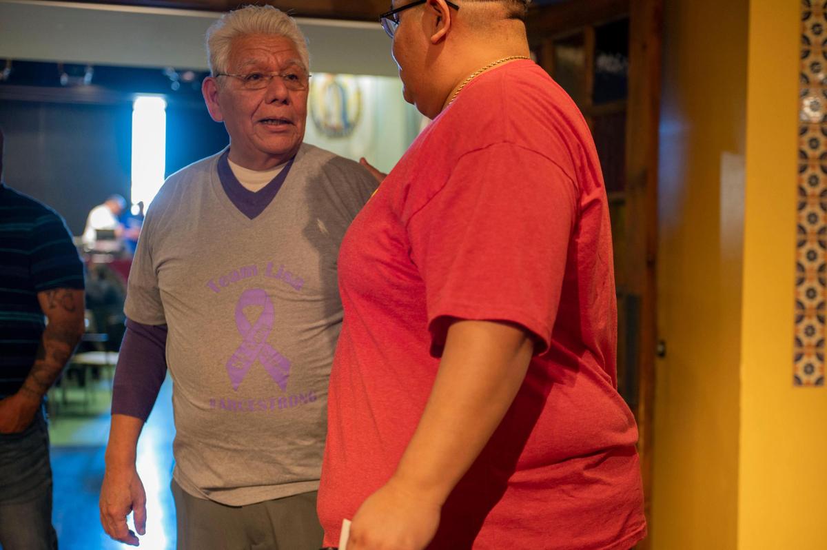 Joe Arce speaks to a friend during a March 19 fundraiser for his daughter at Guadalupe Centers in Kansas City. “I’m used to giving but I’m not used to receiving,” Arce said. “That’s part of our culture, to help, there’s just no way about it. It’s part of our culture.”