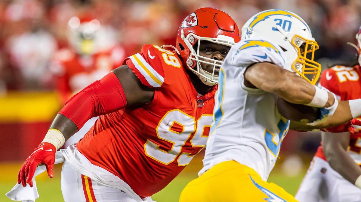 Kansas City Chiefs defensive tackle Khalen Saunders (99) goes to tackle Los Angeles Chargers running back Austin Ekeler (30) during the home opener game between the Kansas City Chiefs and the LA Chargers on Thursday September 15, 2022 at Arrowhead Stadium in Kansas City, Missouri