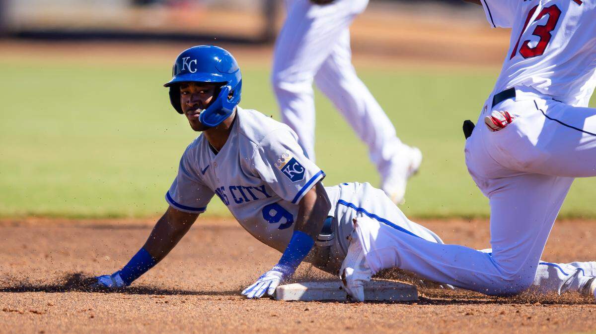 Royals infielder Samad Taylor (9) of the Surprise Saguaros steals second base ahead of the tag by Guardians infielder Angel Martinez for the Peoria Javelinas during an Arizona Fall League baseball game at Peoria Sports Complex on Oct. 7, 2022.