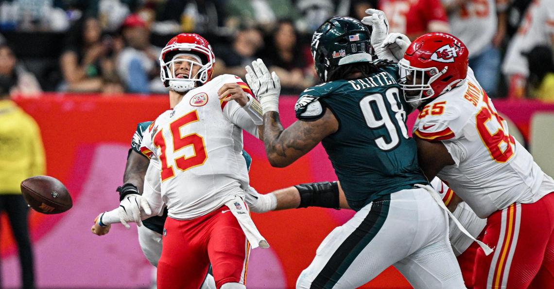 Philadelphia Eagles defensive tackle Milton Williams (93) strips the ball from Kansas City Chiefs quarterback Patrick Mahomes (15) in the fourth quarter during Super Bowl LIX on Sunday, Feb. 9, 2025, in New Orleans. The Eagles recovered the ball on the play.