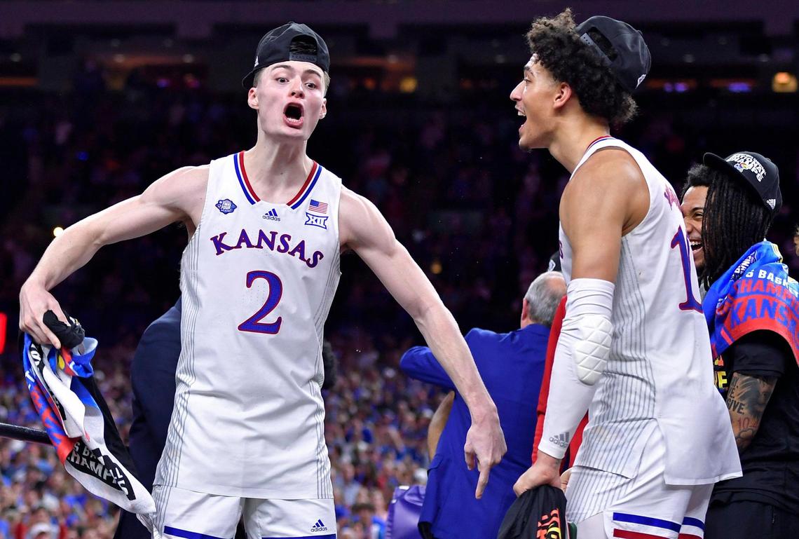 KU’s Christian Braun, left, and Jalen Wilson celebrate the Jayhawks NCAA title Monday night at the Superdome.