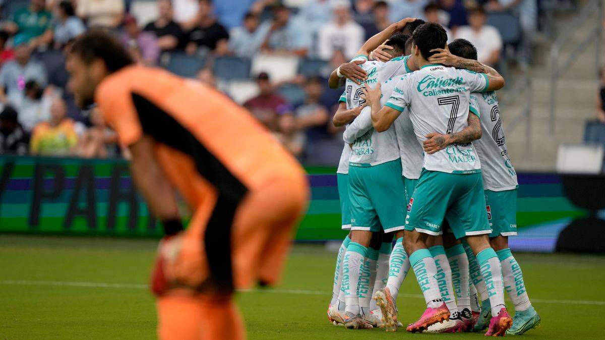 León players celebrate after midfielder Santiago Colombatto scored a goal during the first half of a Leagues Cup quarterfinal soccer match against Sporting Kansas City, Tuesday, Aug. 10, 2021, in Kansas City, Kan. (AP Photo/Charlie Riedel)