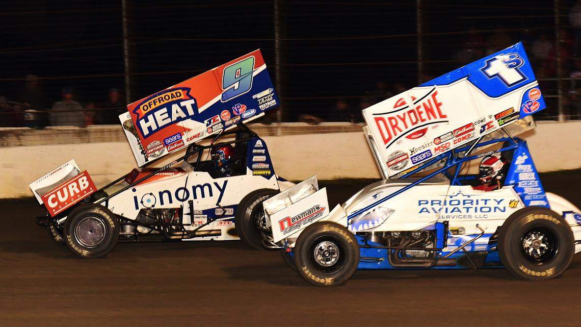 Daryn Pittman (No. 9) battles Logan Schuchart Friday night at Lakeside Speedway.
