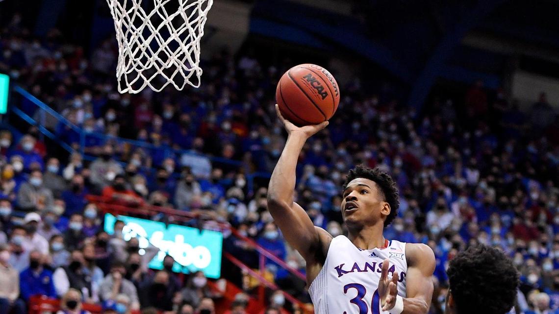 KU’s Ochai Agbaji rose above the crowd as he drove the lane during the second half of Monday night’s game at Allen Fieldhouse. KU beat Tech, 94-91 in double overtime.