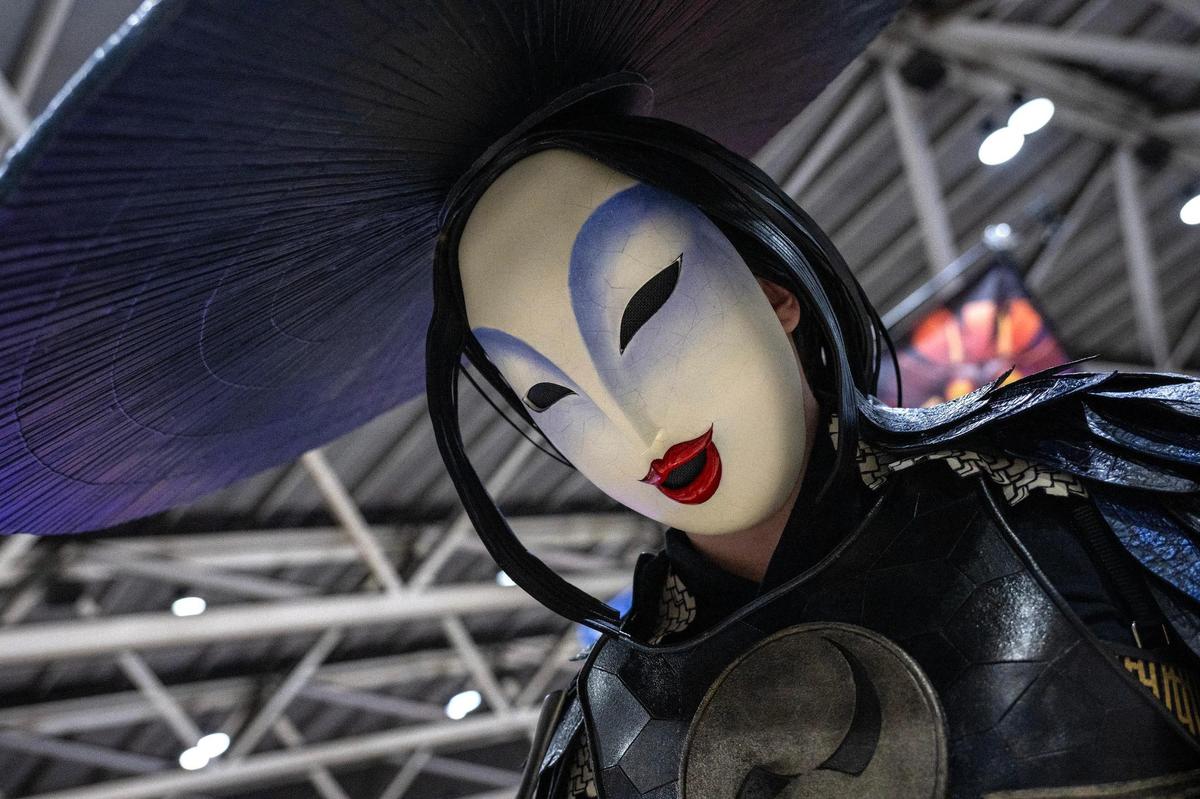 Erin Carpenter cosplays as the character Washi from “Kubo and the Two Strings” during Planet Comicon at the Kansas City Convention Center on Friday.