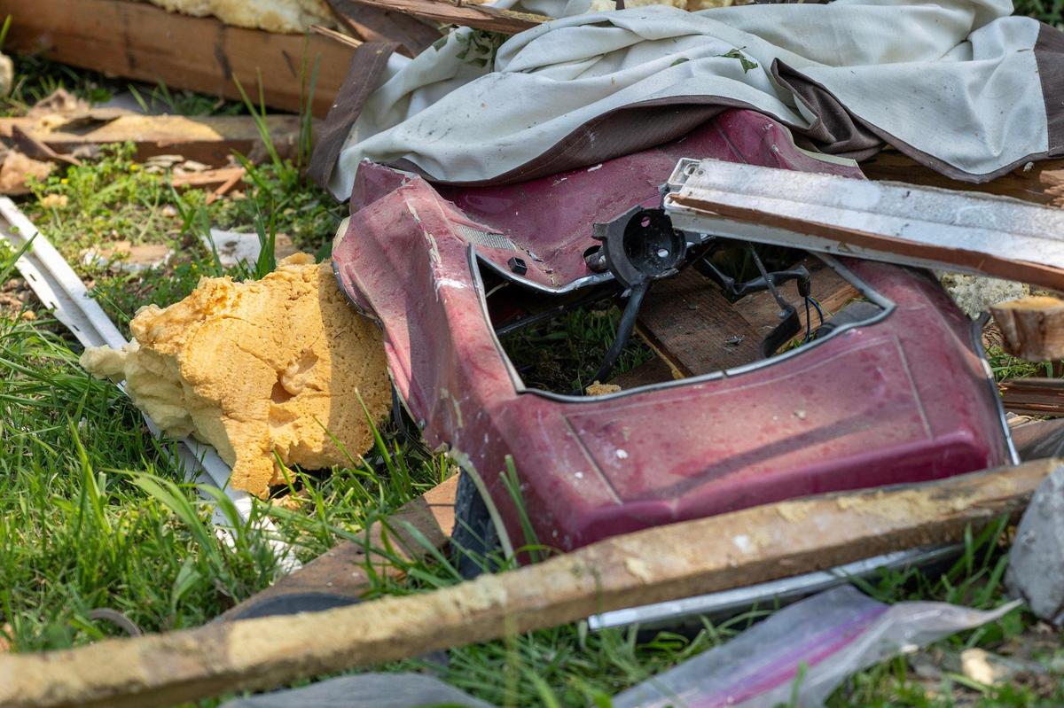A toy car sits among debris on Sunday, June 1, 2025, in Gladstone. The remains were left scattered after a home explosion the day before that killed one person and damaged nearby houses.