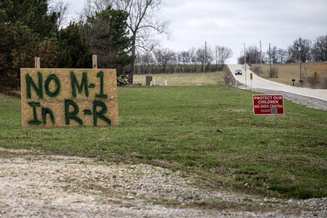 Picket signs are seen along 191st Street on Saturday, March 7, 2026, in Spring Hill, Kansas.