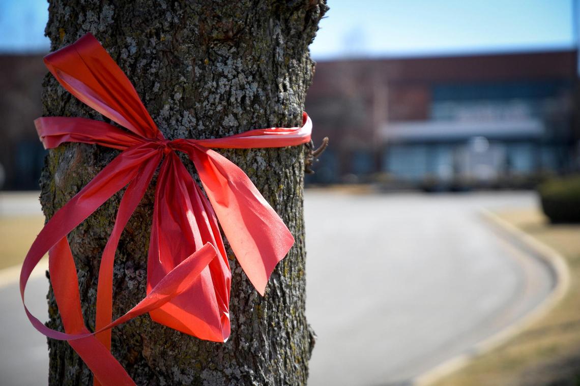 Nearly two weeks after a shooting left three injured at Olathe East High School, a red ribbon tied around a tree outside the school was a sign of support.