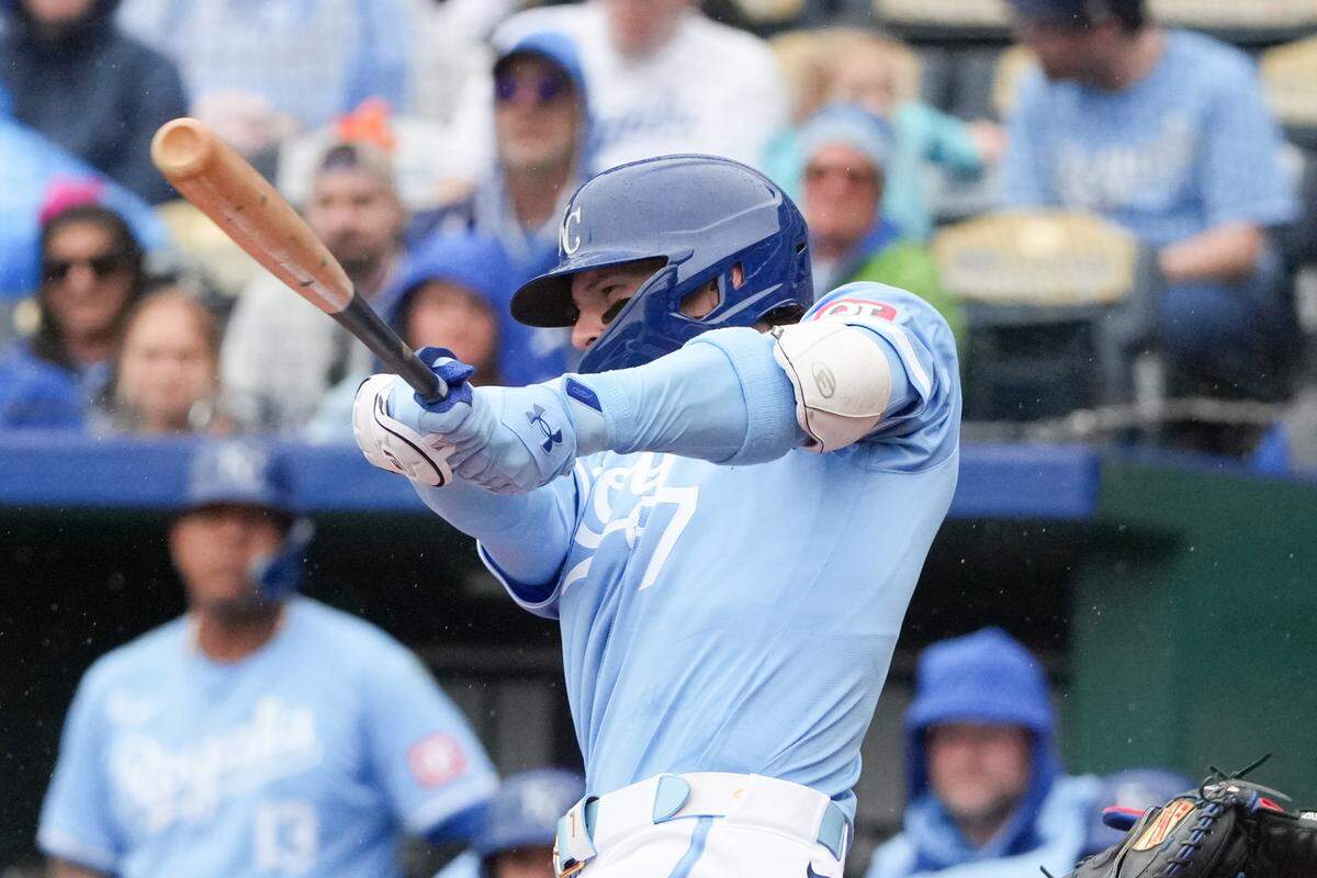 Kansas City Royals shortstop Bobby Witt Jr. connects for a first-inning triple against the Texas Rangers on Sunday at Kauffman Stadium.