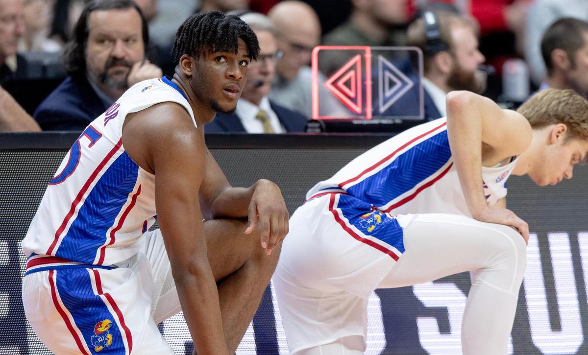 Kansas forward Zuby Ejiofor (35) readies to check into the game for center Ernest Udeh Jr. during a second-round college basketball game against Arkansas in the NCAA Tournament Saturday, March 18, 2023, in Des Moines, Iowa.