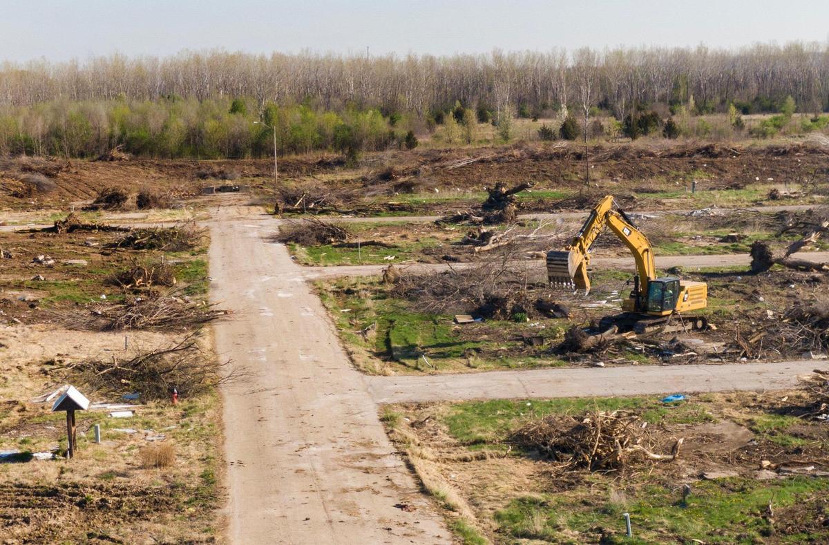 Heavy equipment removed trees Wednesday on the site of the new Jackson County Detention Center. The project is on hold.