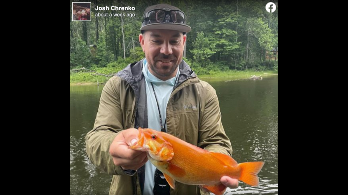 Josh Chrenko caught an orange smallmouth bass, which he said has a condition called Xanthochromism.