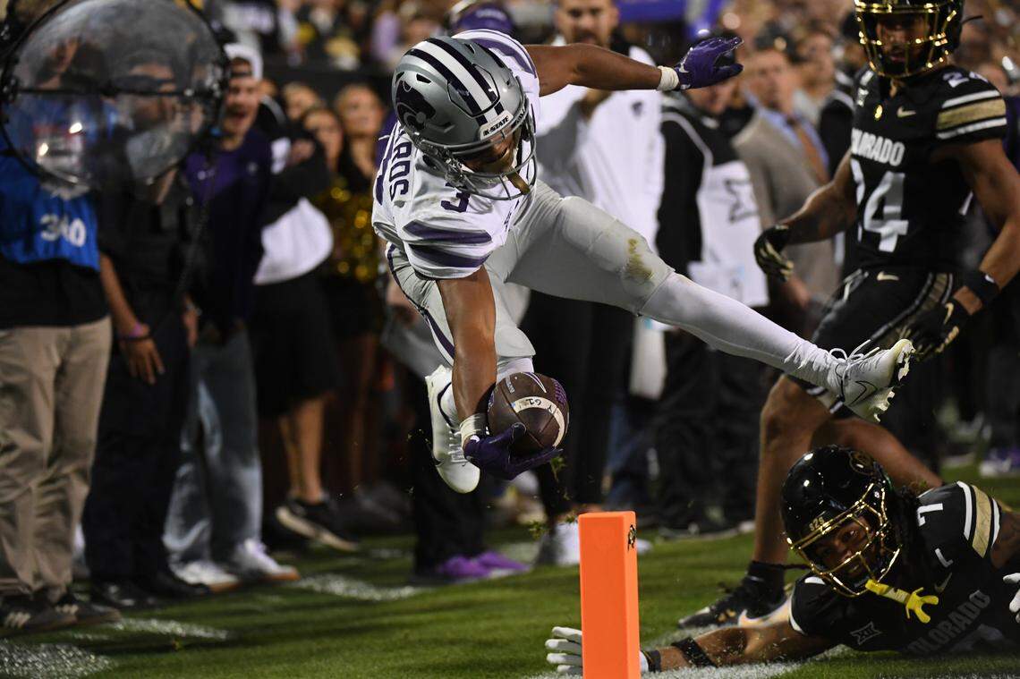 Kansas State Wildcats running back Dylan Edwards dives for the pylon during Saturday night’s Big 12 football game against the Colorado Buffaloes at Folsom Field in Boulder, Colo. He was just short but the Cats scored soon after.