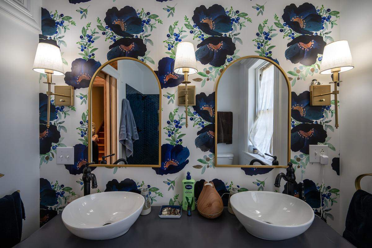 A wallpaper featuring blueberries adorns the primary bathroom at the Bezanson family home on Wednesday, April 8, 2026, in Kansas City.