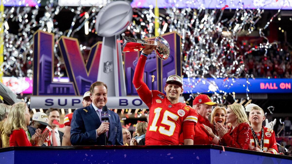Kansas City Chiefs quarterback Patrick Mahomes (15) hoists the Lombardi Trophy after the Chiefs defeated the San Francisco 49ers in overtime 25-22 in Super Bowl LVIII on Sunday, Feb. 11, 2024, in Las Vegas.