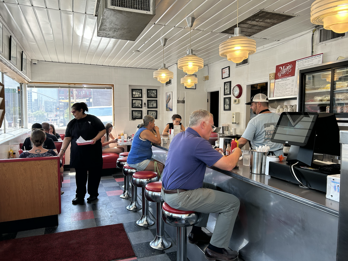At lunch time on a recent Friday afternoon, the small Baltimore Avenue location of Town Topic is packed with about a dozen customers.