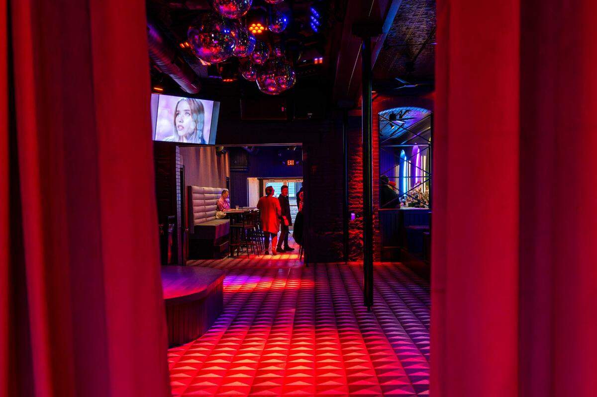 Curtains are drawn at the main entrance, obscuring the view of the dance floor and main bar area at Q Kansas City on Friday in Westport.