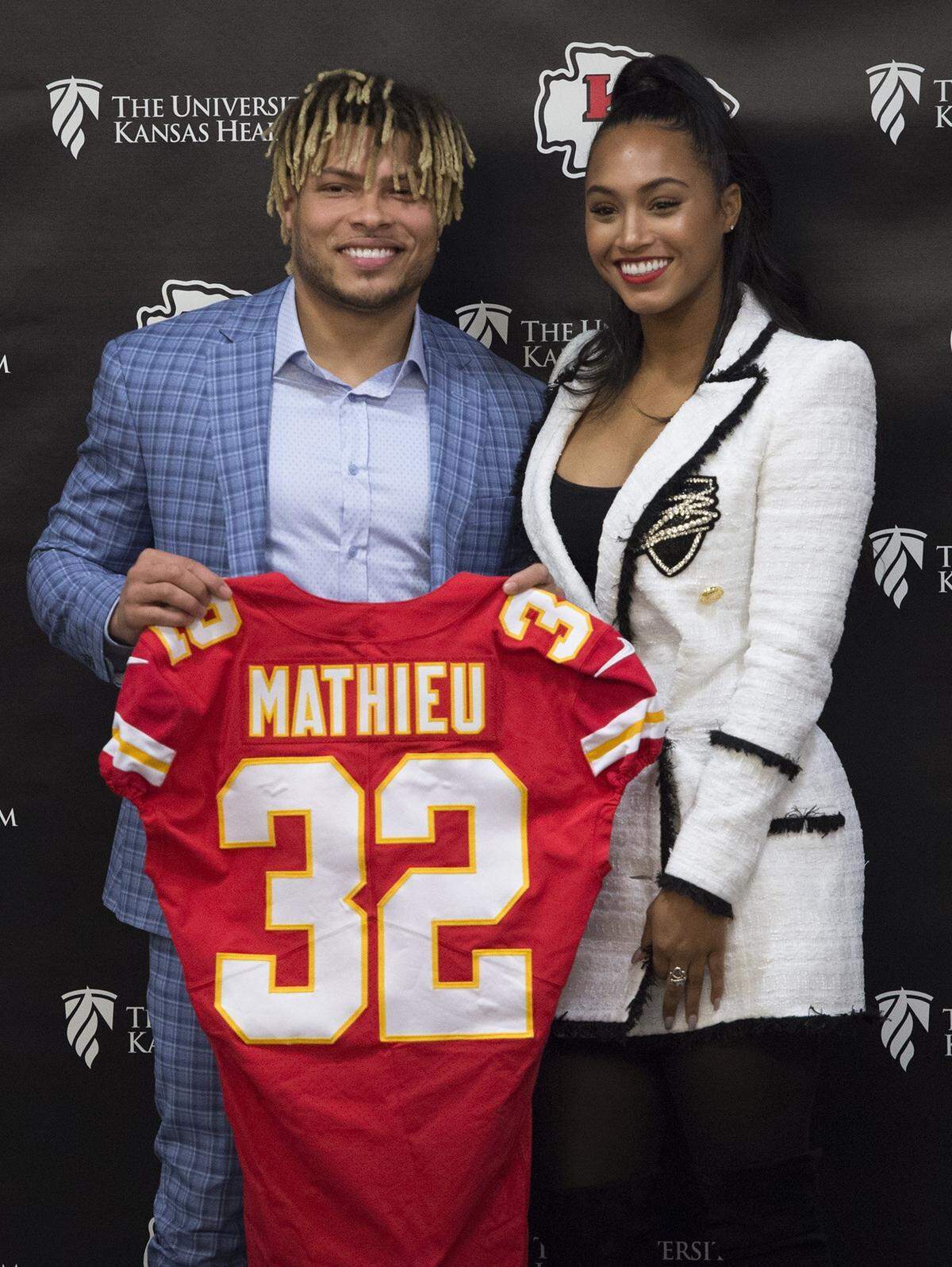 After being introduced, Chiefs new safety Tyrann Mathieu posed for a photo with his longtime girlfriend Sydni Paige Russell in the Stram Theater on Thursday at the Chiefs practice facility in Kansas City. The Chiefs signed Mathieu to a three-year deal reportedly worth $42 million.