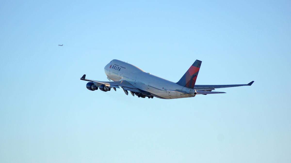 A woman assaulted a Delta flight attendant during an argument about overhead bin space, Minnesota police said.