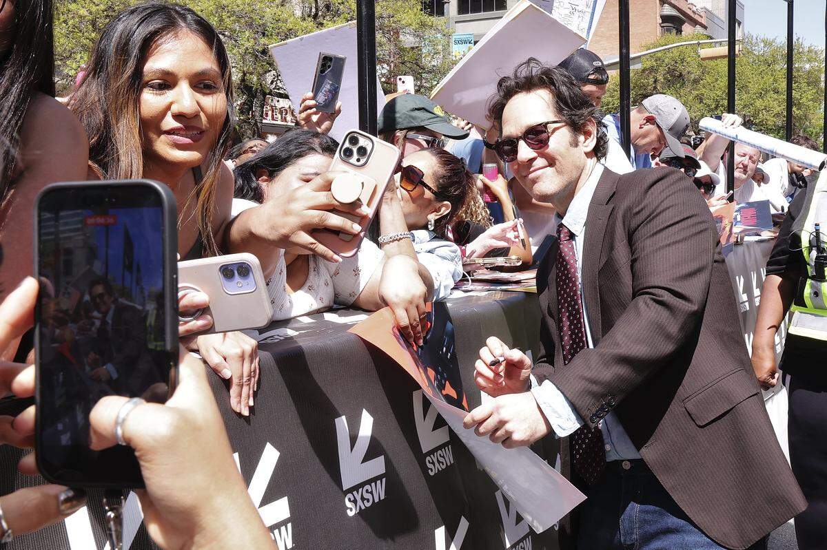 Paul Rudd greets fans during the premiere of "Power Ballad" during SXSW at The Paramount Theatre on March 14, 2026 in Austin, Texas.