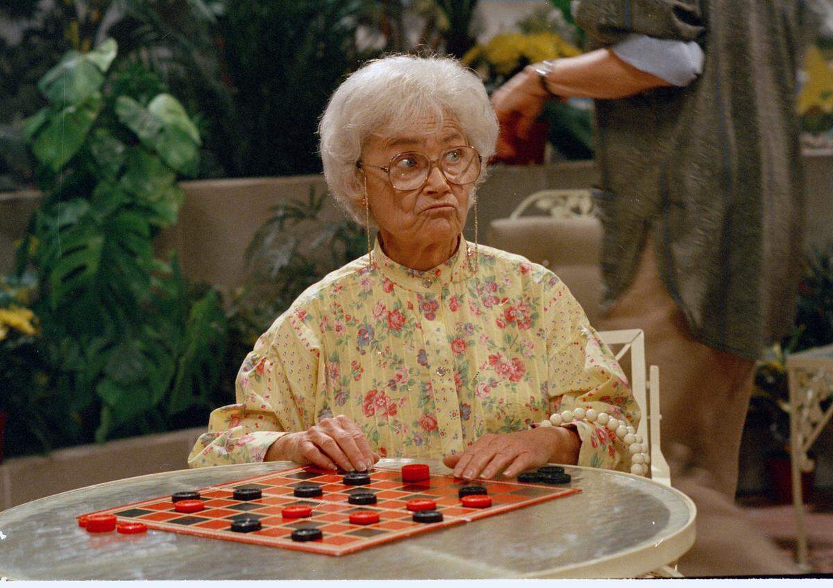 Actress Estelle Getty, one of the stars of the TV series “The Golden Girls,” pouts when the checkers game does not go her way during taping in 1985.