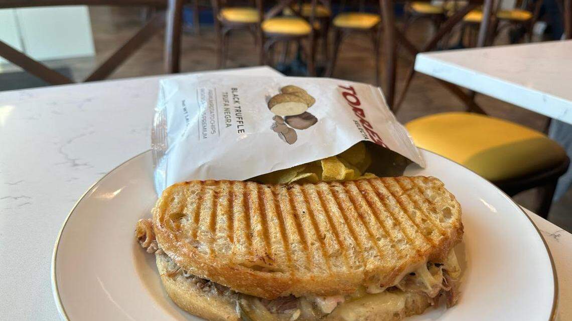 Vintage ’78’s Bay of Pigs sandwich has shaved French 75 ham, pulled pork, dill pickle, Gruyere and stone ground mustard on sourdough.