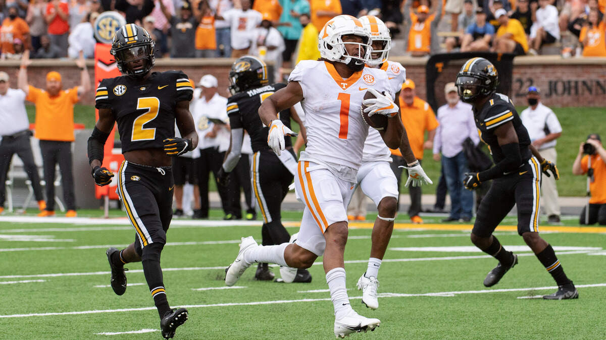 Tennessee wide receiver Velus Jones Jr., right, scores a touchdown in front of Missouri defensive back Ennis Rakestraw Jr., left, during the first half of an NCAA college football game Saturday, Oct. 2, 2021, in Columbia, Mo. (AP Photo/L.G. Patterson)
