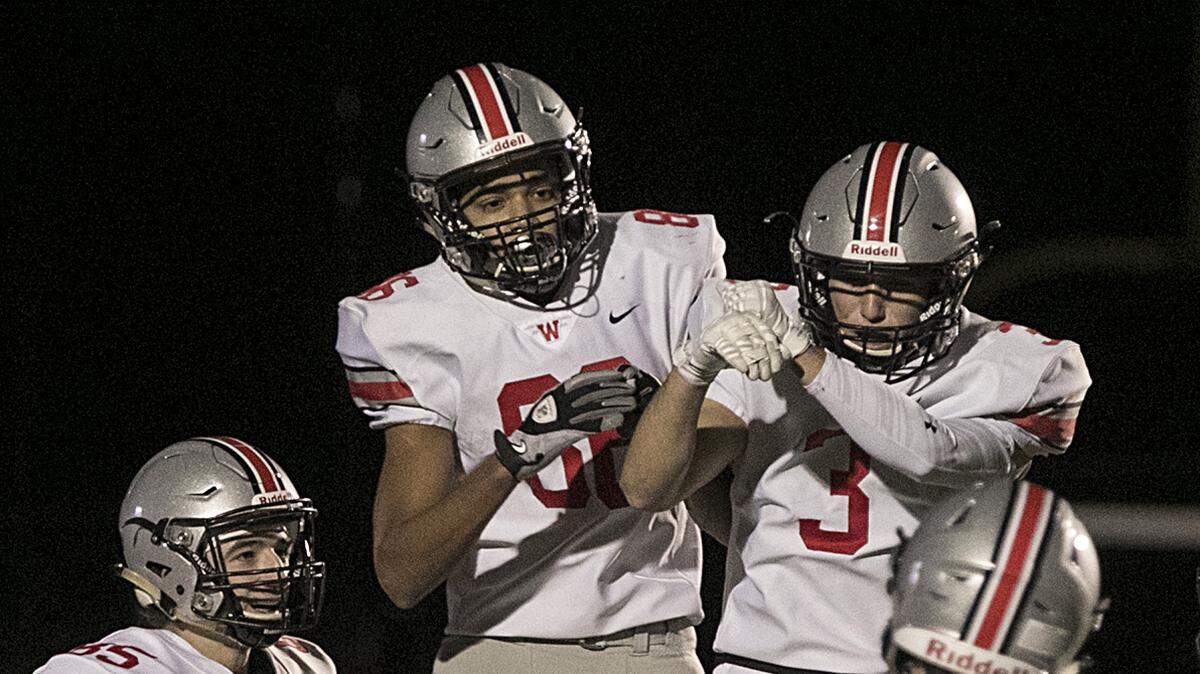 David Brown (No. 86) of Blue Valley West celebrated with teammates after scoring a touchdown in the second quarter against Shawnee Mission Northwest at Shawnee Mission North Stadium.