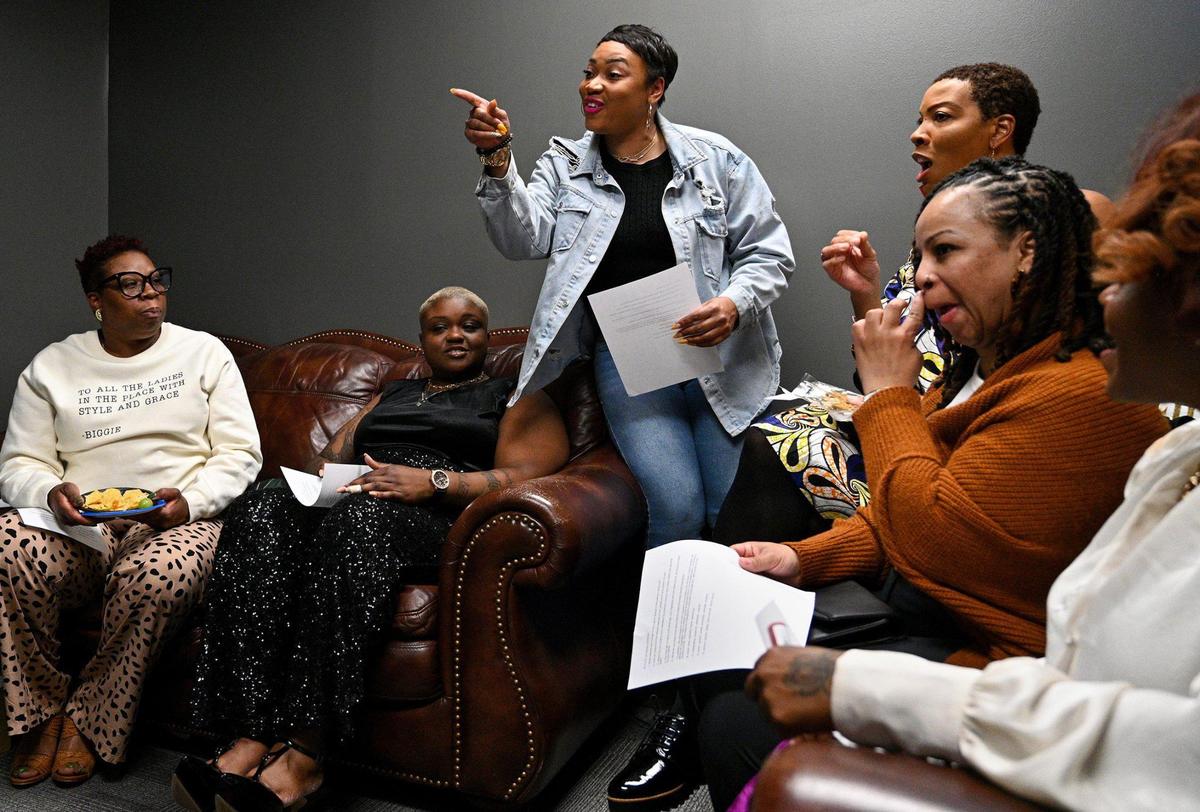 Christina Williams, co-owner of The Blakk Co., talks with panelists to prepare them before the event. The Blakk Co., a social club in Kansas City for men of color, for the first time held a series of events intended to provide networking opportunities for women of color. The final event, Wednesday, March 30, 2022, focused on the culinary industry.