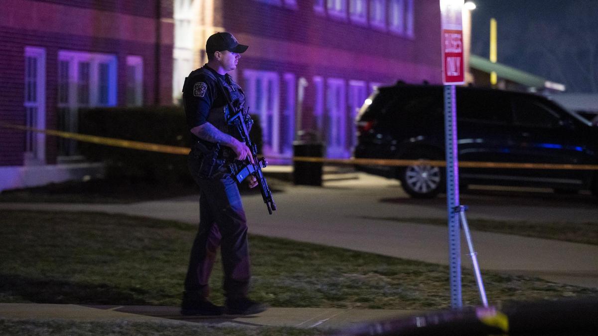 A Clay County sheriff’s deputy walks to his vehicle at the scene of a shooting outside of North Kansas City High School on Saturday, March 2, 2024, in Kansas City.
