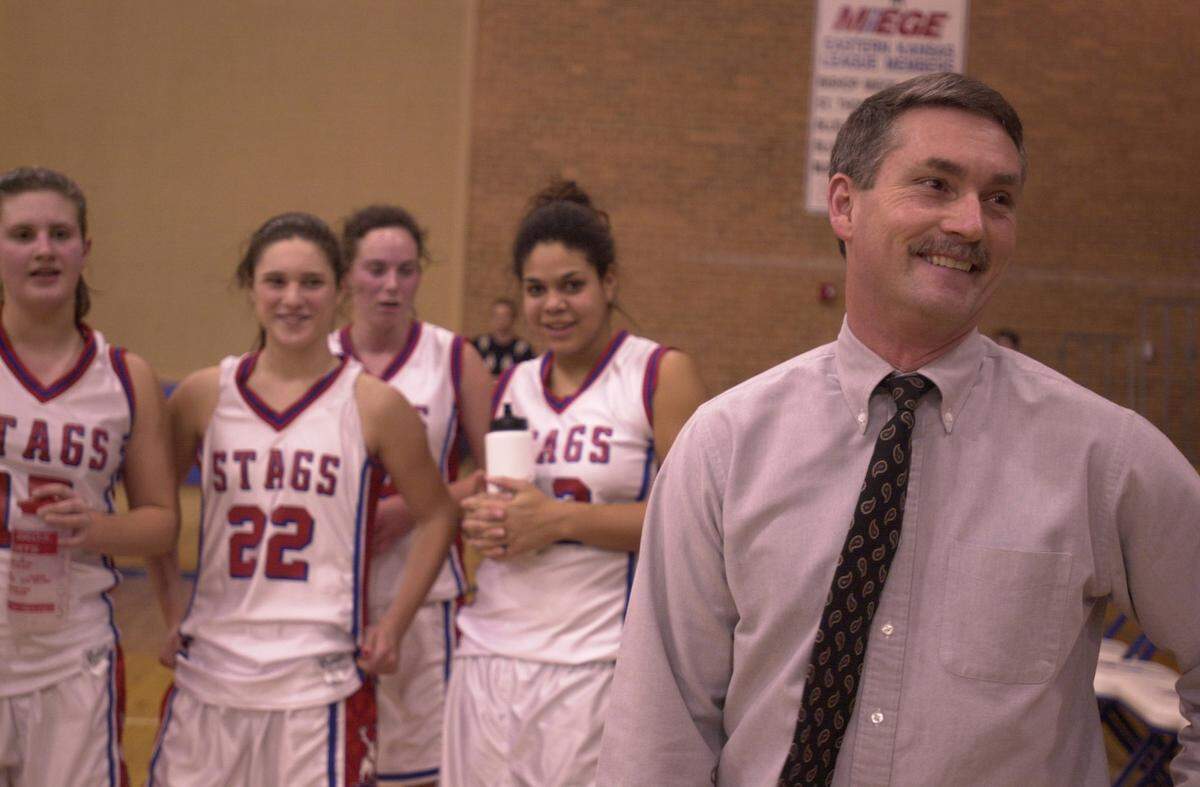 Bishop Miege coach Terry English smiled after the Stags’ first-round victory in a holiday tournament netted him the 500th win of his career.