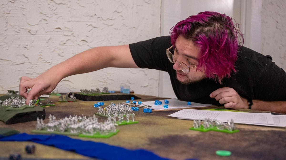 April Thomas, 20 , a sophomore from Independence and president of the school’s war-gaming club, attacks with Picti warriors at Baker University in Baldwin City.