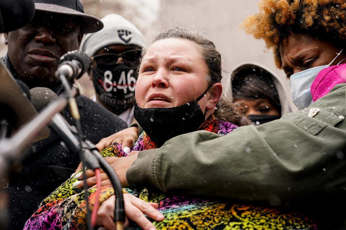 Katie Wright, center, mother of Daunte Wright, speaks during a news conference, Tuesday, April 13, 2021, in Minneapolis. Daunte Wright, 20, was shot and killed by police Sunday after a traffic stop in Brooklyn Center, Minn. (AP Photo/John Minchillo)