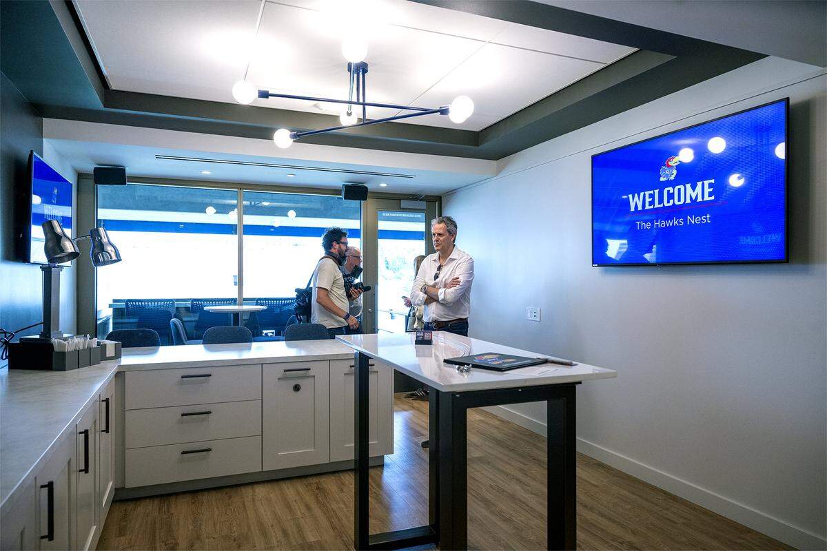 Guests view the Hawks Nest suite during a tour showing off the $450 million in renovations at David Booth Kansas Memorial Stadium on Tuesday, Aug. 19, 2025, at the University of Kansas in Lawrence.  
