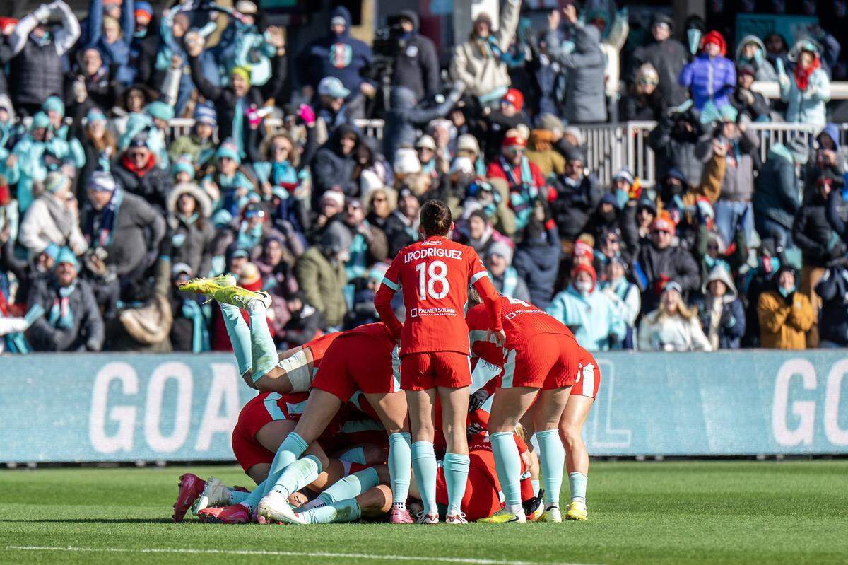 KC Current players huddle to celebrate a goal by defender Ellie Wheeler during an NWSL quarterfinal playoff match at CPKC Stadium in Kansas City on Sunday, Nov. 9, 2025.