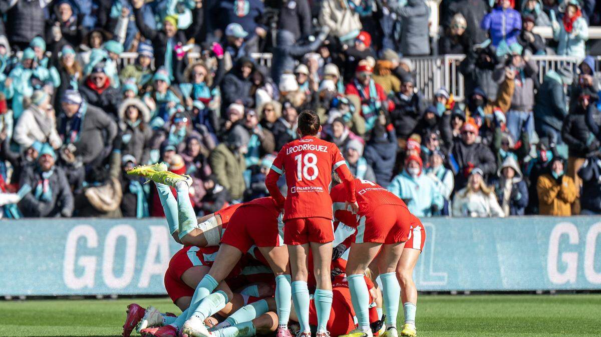 KC Current players huddle to celebrate a goal by defender Ellie Wheeler during an NWSL quarterfinal playoff match at CPKC Stadium in Kansas City on Sunday, Nov. 9, 2025.