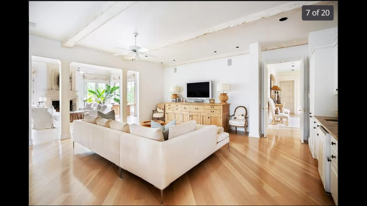 The living room extends, leading guests to one of eight fireplaces on the property.