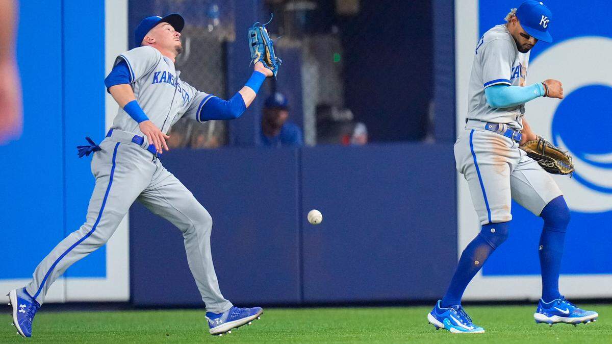 Royals center fielder Drew Waters, left, drops what looked to be a routine catch as right fielder MJ Melendez moves out of the way on Monday against the Marlins in Miami.