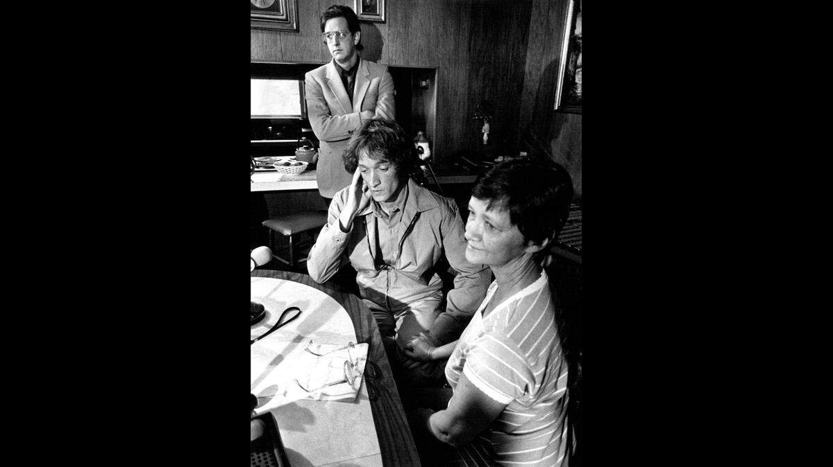 Melvin Lee Reynolds, sitting, his mother, Wanda O’Meara, and his attorney, Lee Nation, answer questions at a press conference. Reynolds falsely confessed to a 1978 homicide in St. Joseph and was exonerated in 1983.