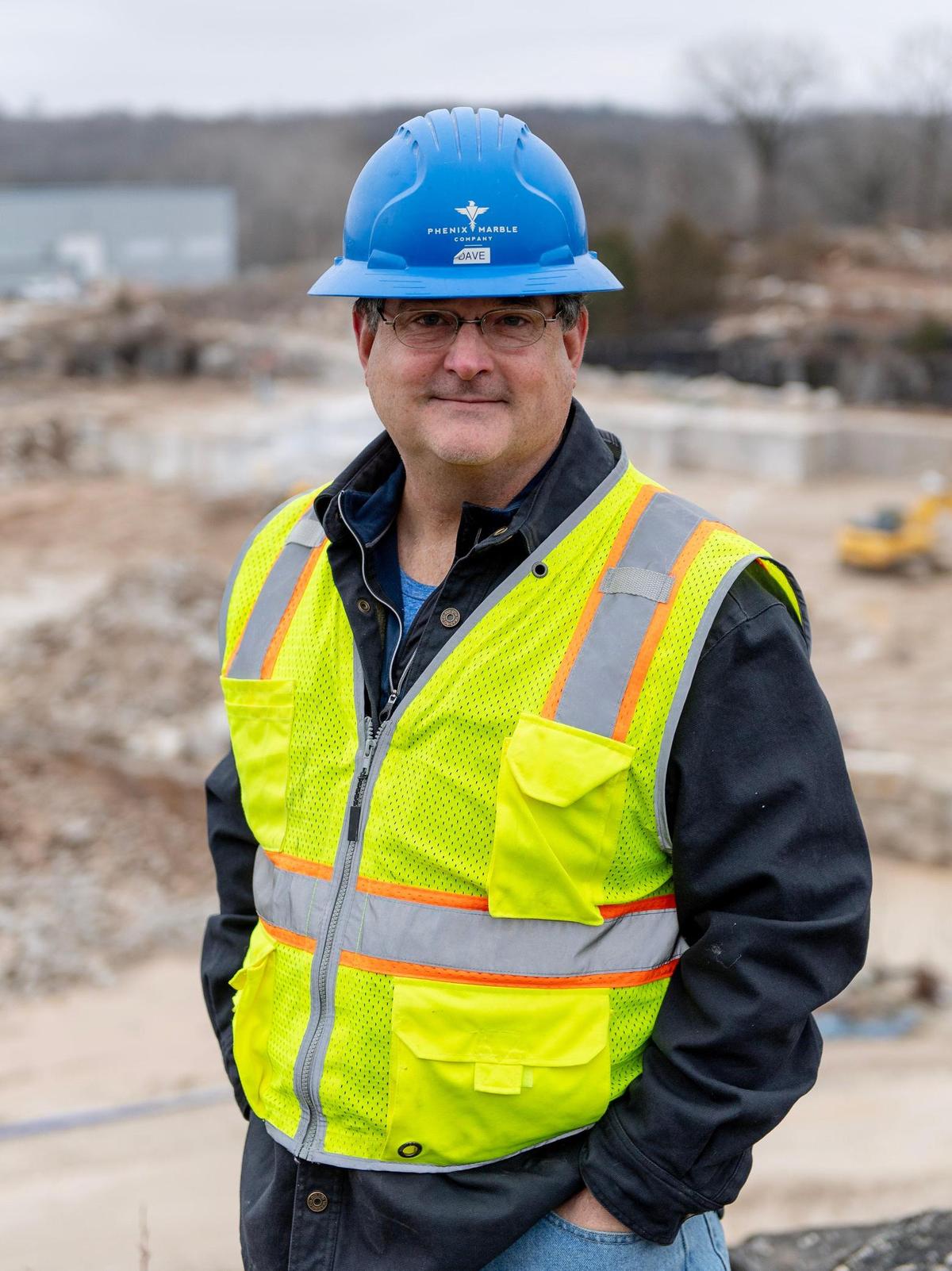 Dave Karr, president of Phenix Marble, poses for a photo on a cliff overlooking the company’s quarry on Thursday, Feb. 16, 2023, in Phenix, Mo.