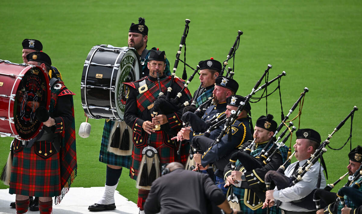 Bag pipers play while the casket Wyandotte County Sheriff's deputy Elijah Ming is carried in through Children's Mercy Stadium on Monday, August 11, 2025, during funeral services for Ming. Ming was killed in the line of duty while responding to a call.