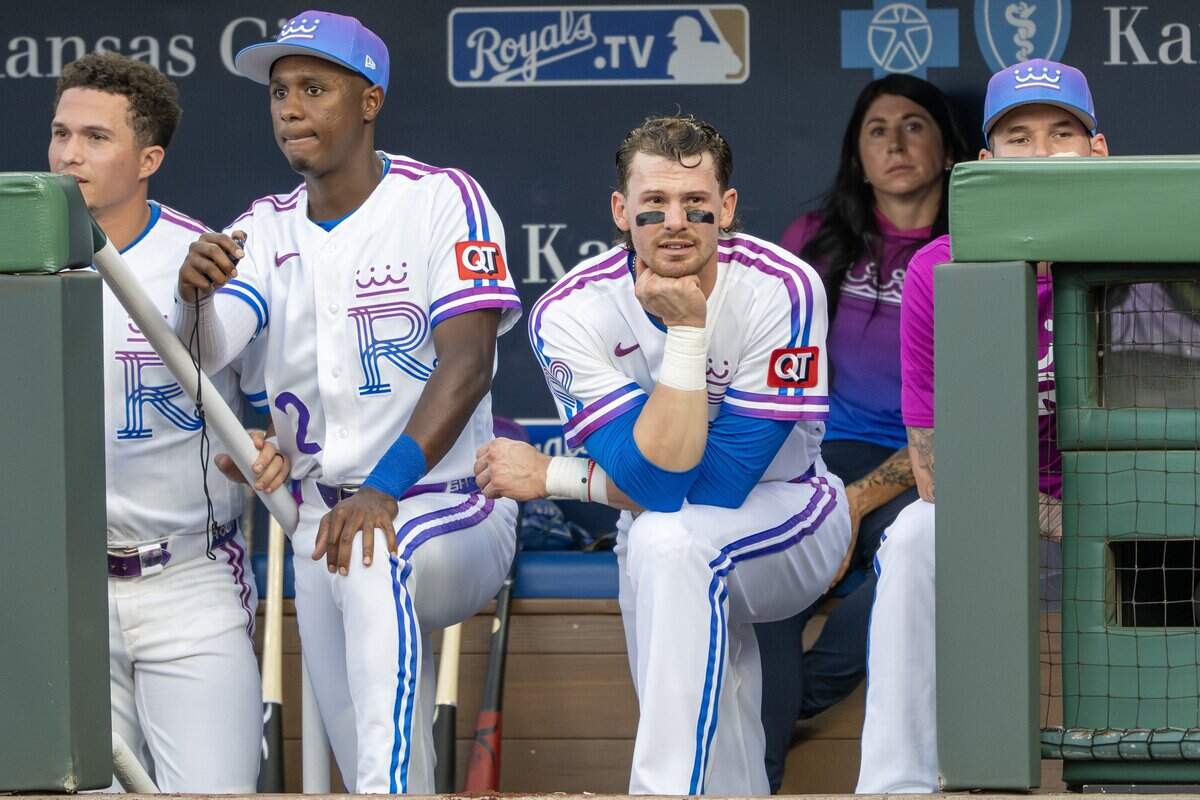 Wearing the Kansas City Royals' new "Forever Fountains" City Connect uniform, shortstop Bobby Witt Jr. (7) watches from the dugout during a game against the Houston Astros on Friday, June 12, 2026, at Kauffman Stadium in Kansas City.