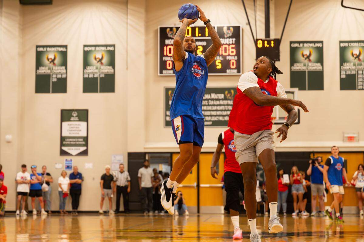 Travis Releford hits a game-winning shot over Brandon Rush during the Rock Chalk Roundball Classic at Free State High in Lawrence, Kansas on Thursday, June 4, 2026.