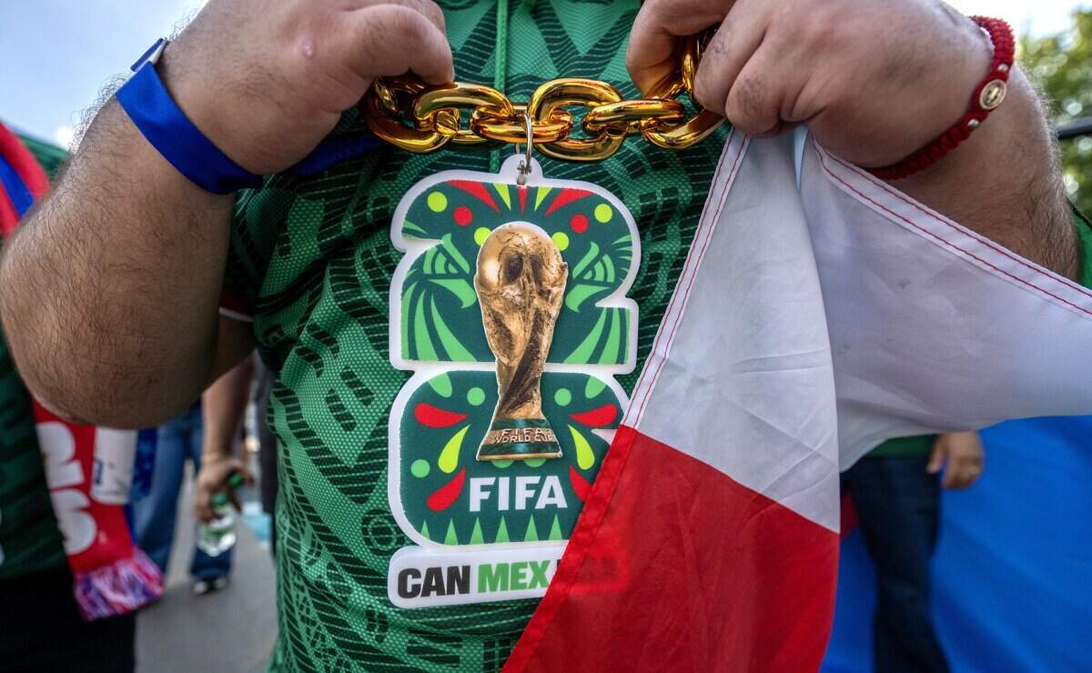 A Mexico fan wears a World Cup-logo chain while dancing at the FIFA Fan Festival on Thursday, June 11, 2026, in Kansas City.