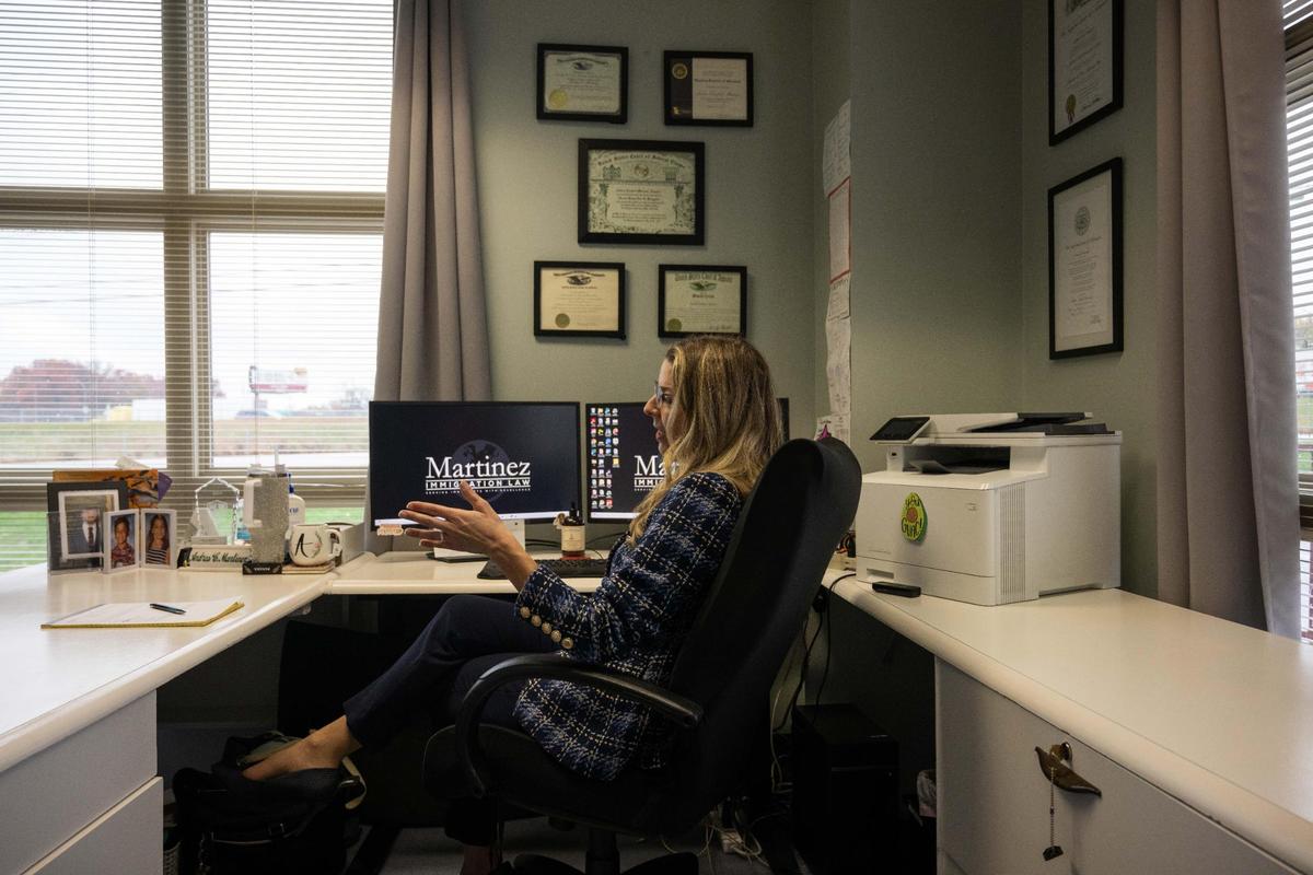 Andrea Martinez, an immigration attorney in Kansas City, talks to a client who is fearful of being deported following the reelection of Donald Trump who has promised the largest mass deportation in U.S. history