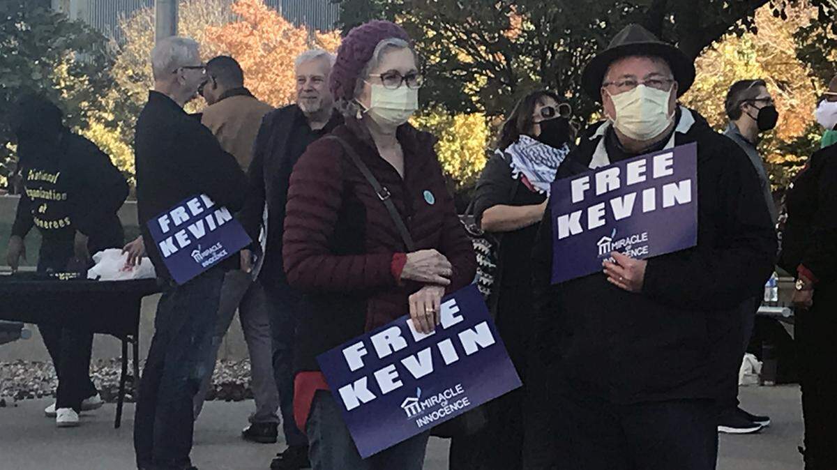 Supporters of Kevin Strickland held “Free Kevin” signs Saturday at the Jackson County Courthouse.