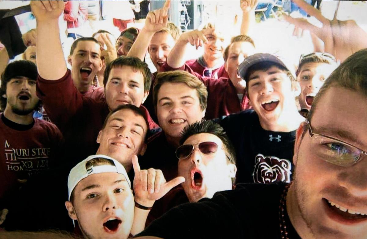 Kindall Johnson, second from left, second row, is seen in a photo taken during the Missouri State homecoming game in Springfield, Missouri in 2015. Johnson, a veteran of the U.S. Marine Corps, killed himself with two bullets to the heart within hours of this photo being taken.